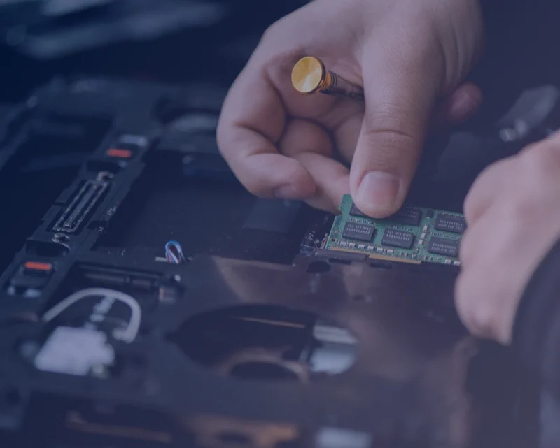 IT Support in process of repairing a laptop 